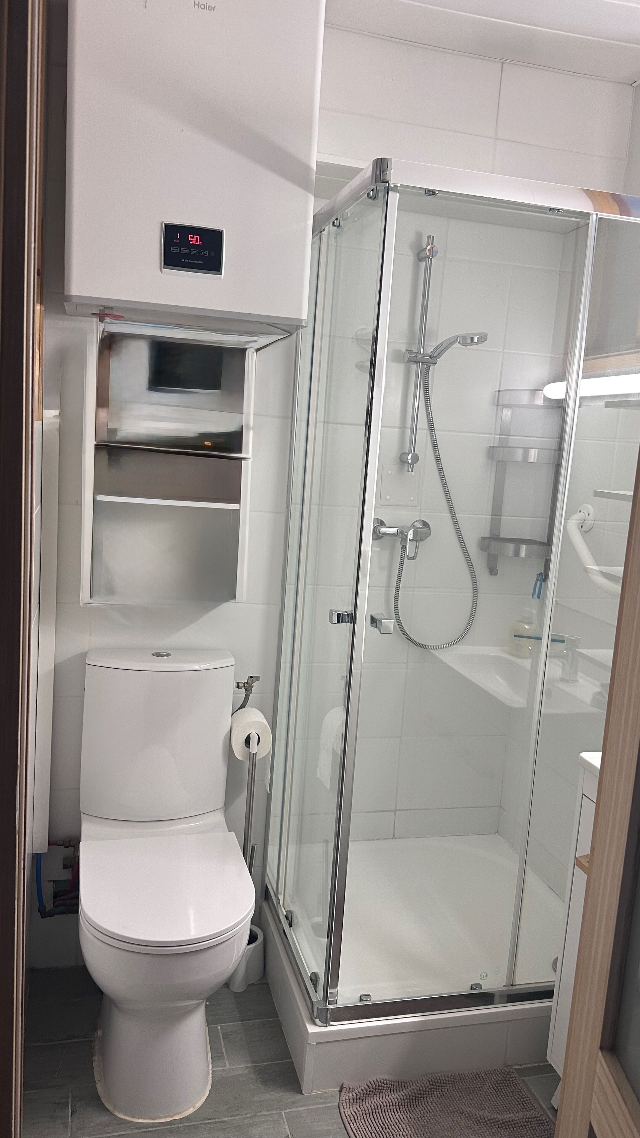 Shower, hair dryer, towels, toilet paper