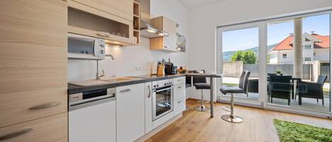 Fridge, stovetop, dishwasher, coffee/tea maker