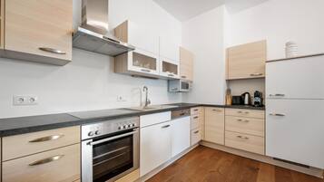 Fridge, stovetop, dishwasher, coffee/tea maker