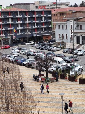 A multi-story parking garage with several cars parked.
