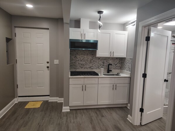 Fridge, microwave, stovetop, coffee/tea maker