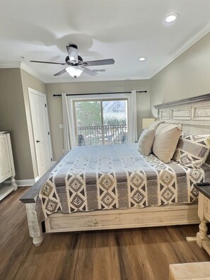 Primary bedroom opens onto its own private balcony