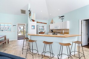 Fridge, coffee/tea maker, toaster, dining tables