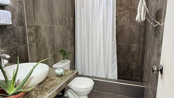 Shower, towels, soap, toilet paper