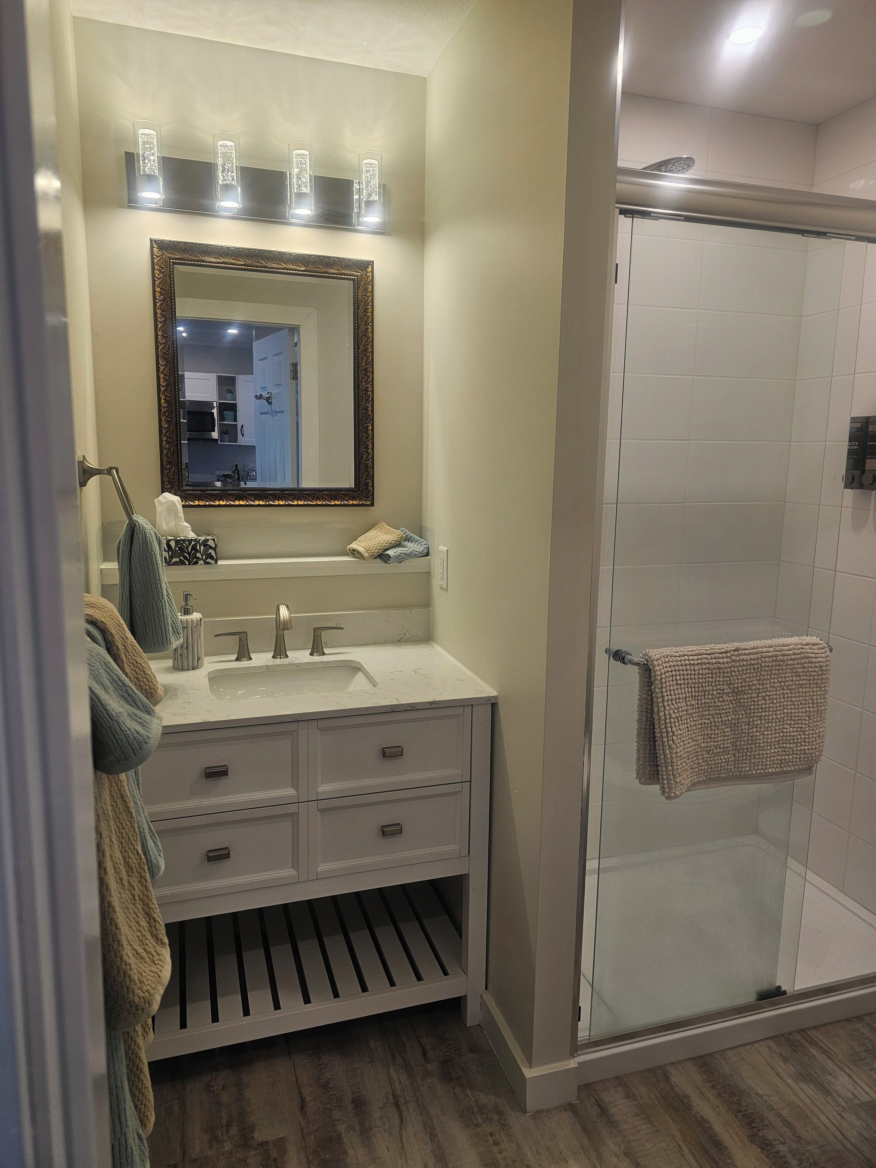 Shower, hair dryer, towels, soap