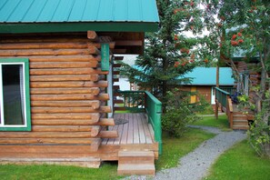 A wooden cabin with a porch and a visible door. - McNeil River Cabin, Homer Floatplane Lodge (Homer)