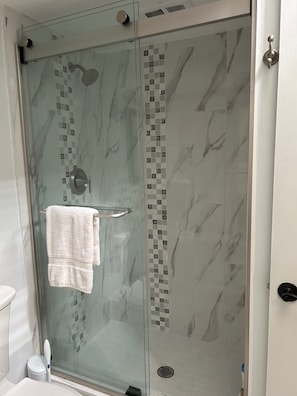Shower, hair dryer, towels, soap