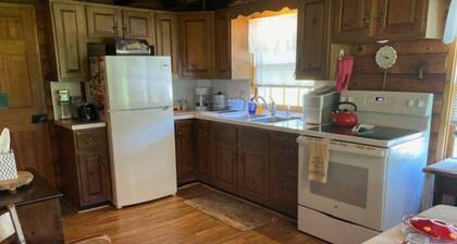 Welcoming to this cozy 3-bedroom cabin on 100 acres, in Tunbridge