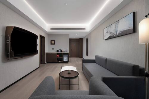 Premium bedding, memory-foam beds, desk, laptop workspace