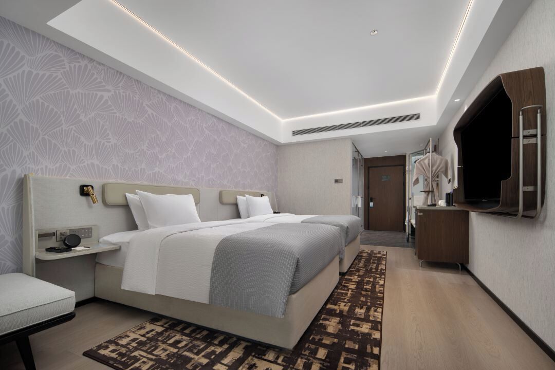 Premium bedding, memory-foam beds, desk, laptop workspace