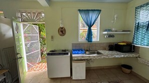 Studio, Patio, Garden View | Private kitchen - Jacoway Inn (Calibishie)