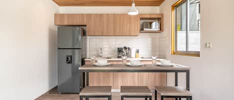 Fridge, microwave, stovetop, coffee/tea maker