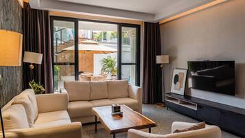 Premium Suite, Beach View | Minibar, desk, laptop workspace, blackout drapes