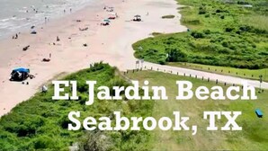 A beach scene with a sign indicating 'El Jardin Beach Seabrook, TX'. - The Mini Mansion on Main Street (La Porte)
