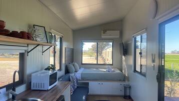 Studio, Balcony, Garden View | Living area | TV