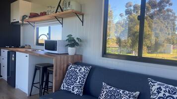 Studio, Balcony, Garden View | Living area | TV