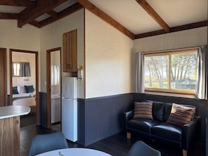 Family Cabin | Living area | TV - Kerang Holiday Park (Kerang)