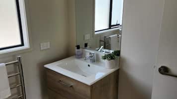 Shower, towels, soap, toilet paper