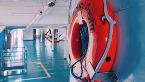 A lifebuoy with the text "BIA" on a ship's interior wall. - IbarcoHotel (Belém)
