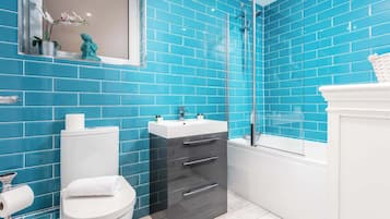 Shower, hair dryer, towels, shampoo