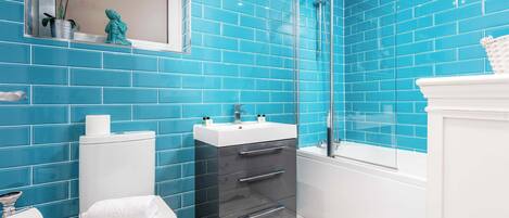 Shower, hair dryer, towels, shampoo