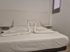 2 habitaciones, tabla de planchar con plancha y internet 