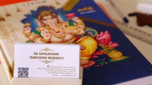 A brochure for Sri Adhilakshmi Templeview Residency with a QR code, address, and contact information.