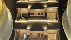 A multi-story building with a sign reading "Sri Adhilakshmi Templeview Residency".