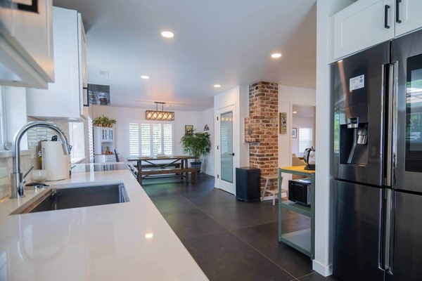 Expansive kitchen awaits your gourmet creations with the latest appliances and equipment