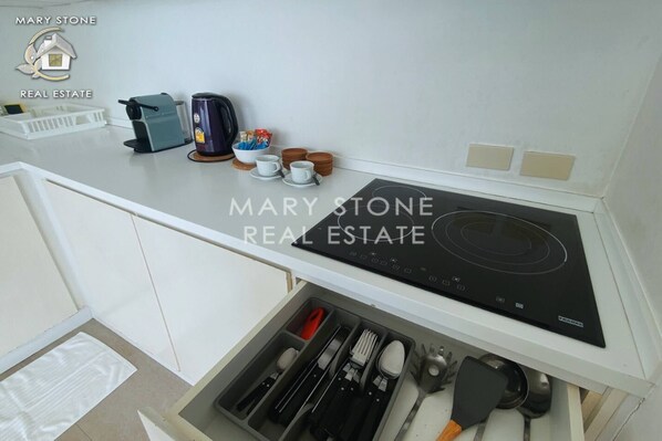 Fridge, microwave, stovetop, coffee/tea maker