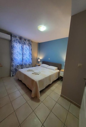 1 bedroom, desk, iron/ironing board, travel crib