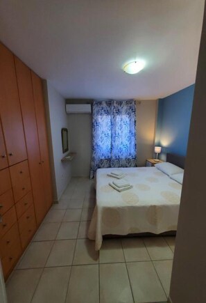 1 bedroom, desk, iron/ironing board, travel crib