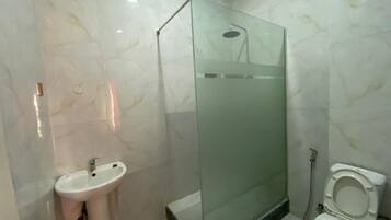 Shower, towels, soap, toilet paper