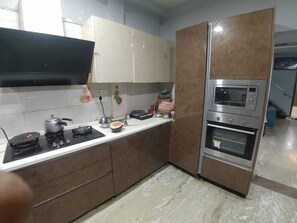 Luxury Apartment, 1 Bedroom, Balcony, City View | Desk, laptop workspace, soundproofing, iron/ironing board - Castle Inn Serviced Apartment (New Delhi)