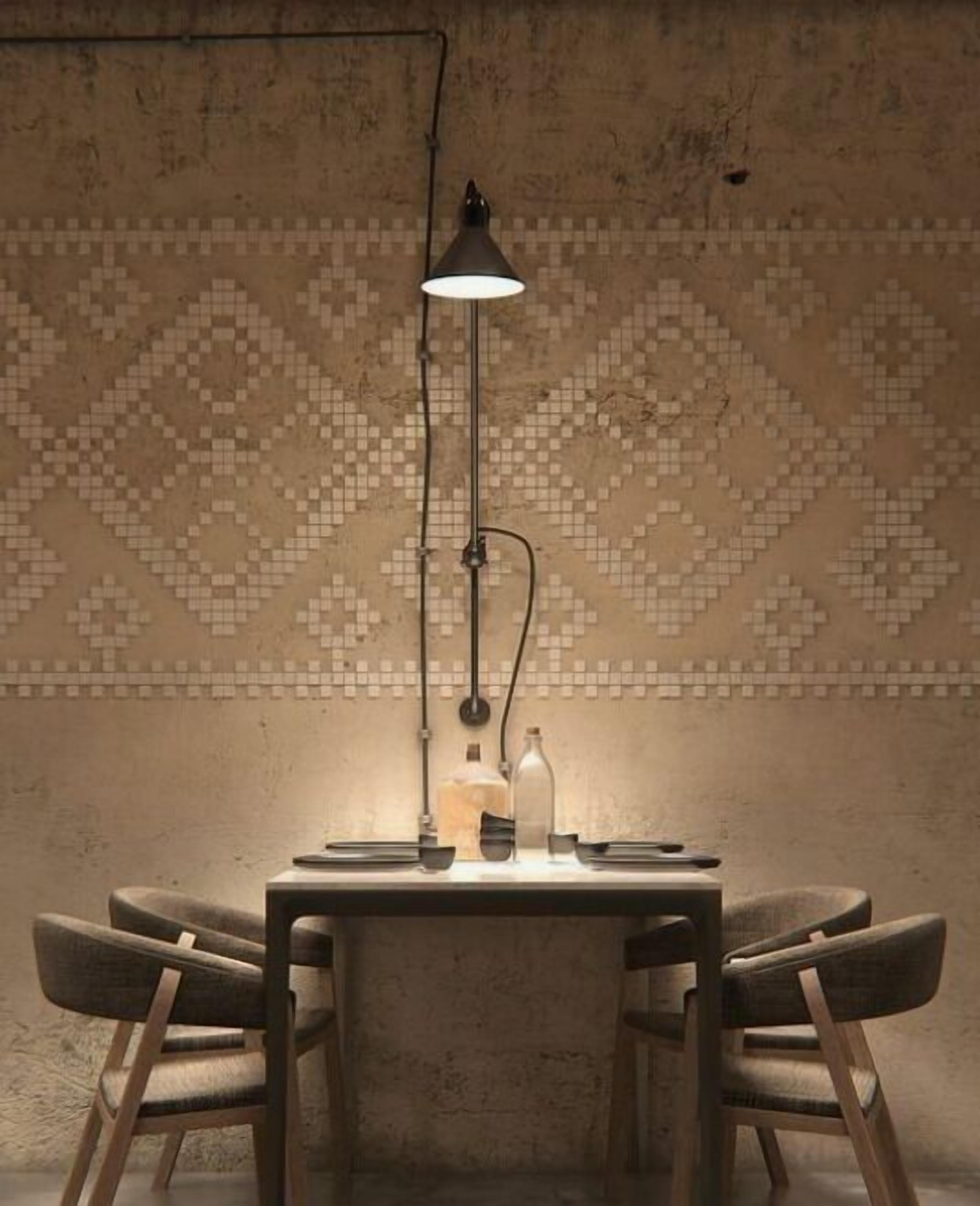 A dining area with a table, chairs, a pendant lamp, and a patterned wall.