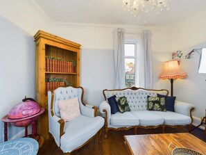 Smart TV, fireplace, books, stereo