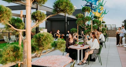 Near RiNo Arts District + Kitchen. Bar. Playroom.