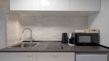 Fridge, microwave, stovetop, coffee/tea maker