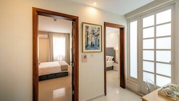 Family Room | Minibar, in-room safe, individually decorated, individually furnished