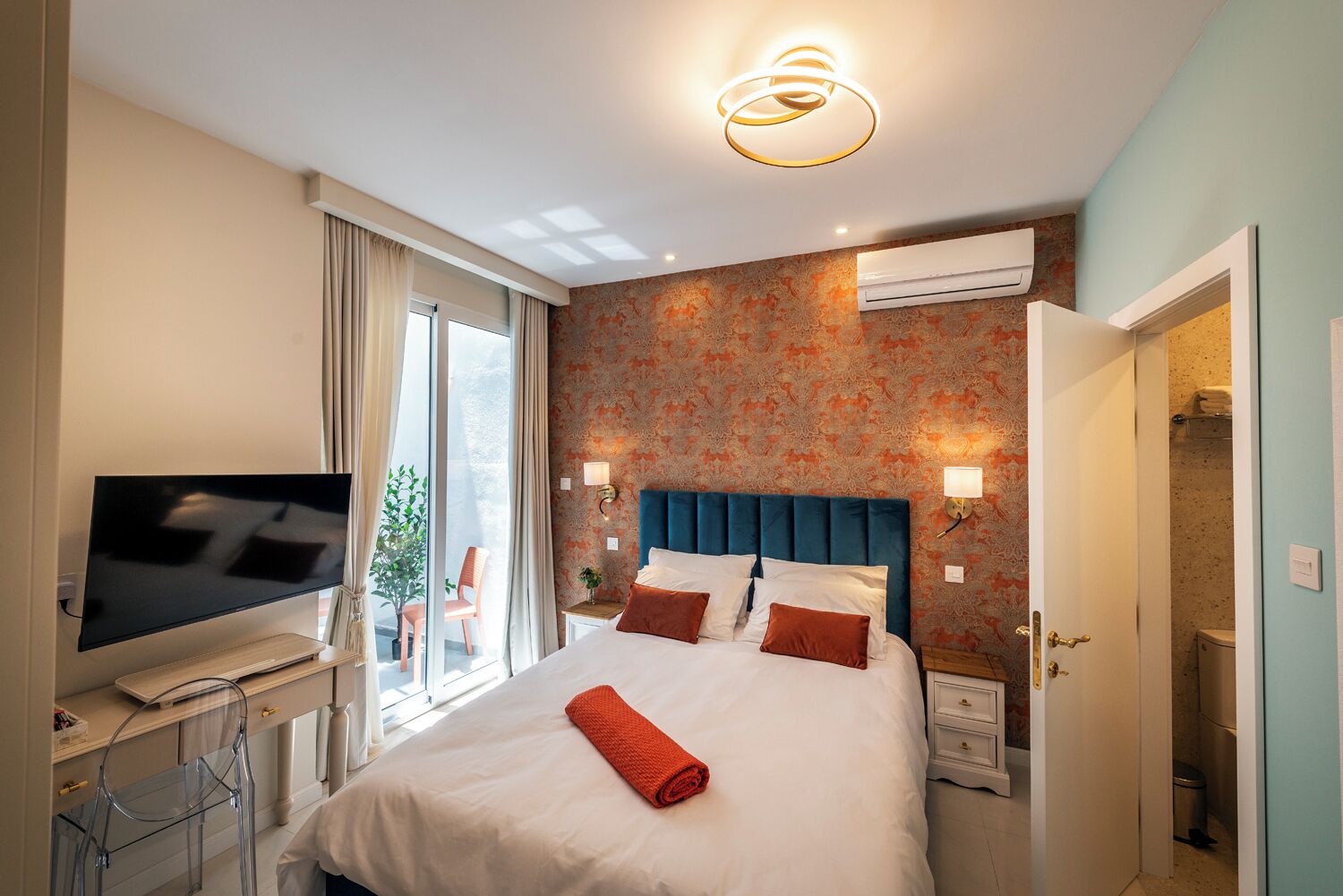 Double Room, Patio | Minibar, in-room safe, individually decorated, individually furnished