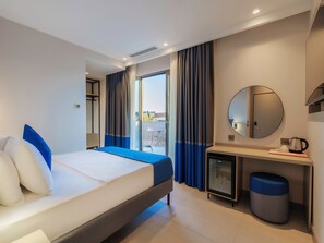 Deluxe Room, City View | In-room safe, desk, laptop workspace, iron/ironing board - Echinus Blue Hotel (Antalya)
