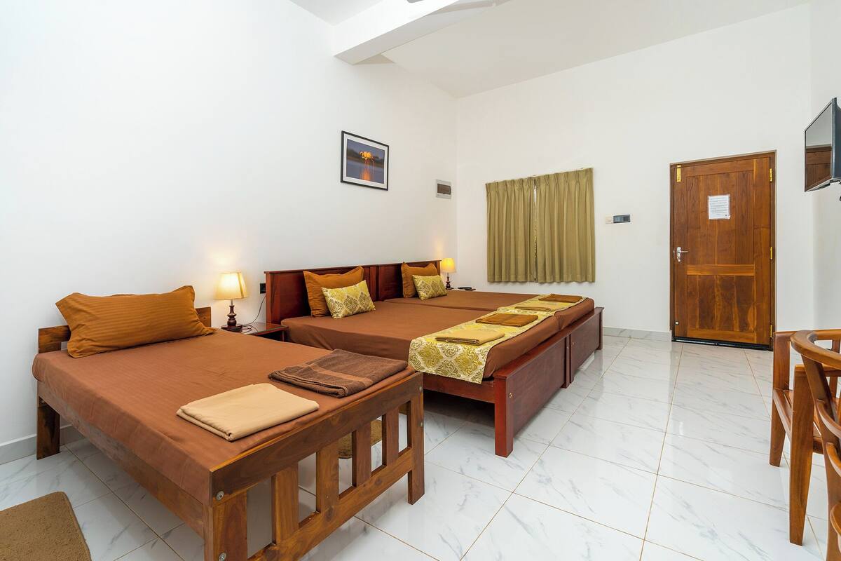 Deluxe Triple Room, Balcony, Mountain View | Desk, laptop workspace, blackout drapes, iron/ironing board