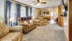 A cozy living room with two sofas, a ceiling fan, and a television mounted on the wall. - Dtwn Belleville Home w/ Yard < 1 Mi to High Banks (Belleville)