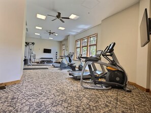 A gym with treadmills, stationary bikes, and a weightlifting area. - NEW LISTING | King Room at Base, Pool & Hot Tub (Crested Butte)