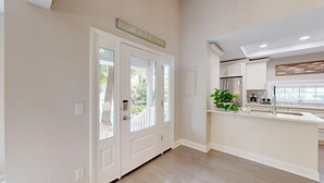 A kitchen with a white countertop, a stainless steel refrigerator, and a potted plant. - Private home in Hilton Head Island with a private pool and hot tub! (Hilton Head)