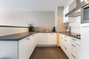 Microwave, stovetop, coffee/tea maker, dining tables
