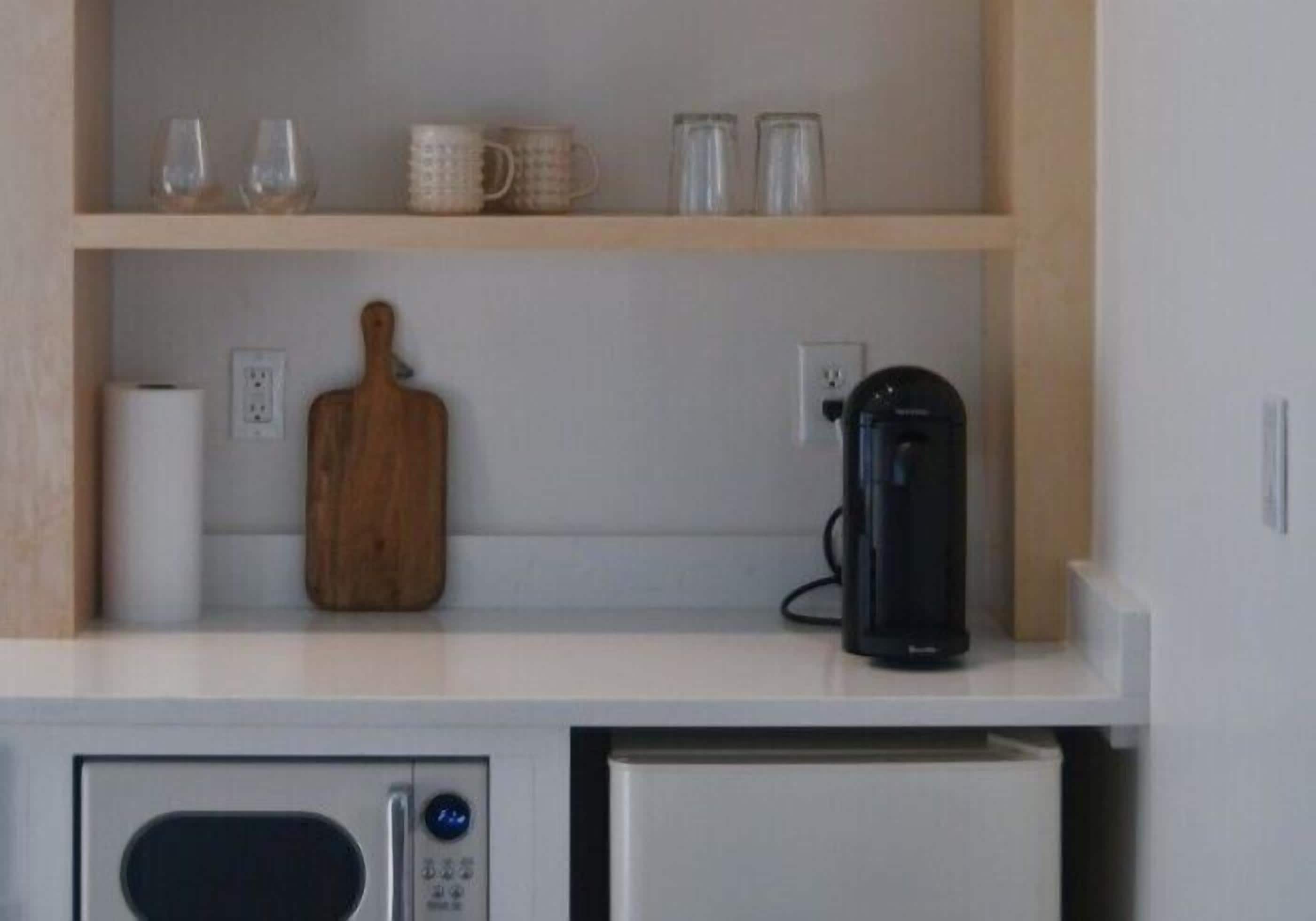 Deluxe Quadruple Room | Private kitchen | Fridge