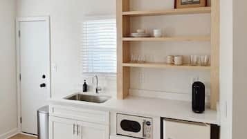 Deluxe Quadruple Room | Private kitchen | Fridge