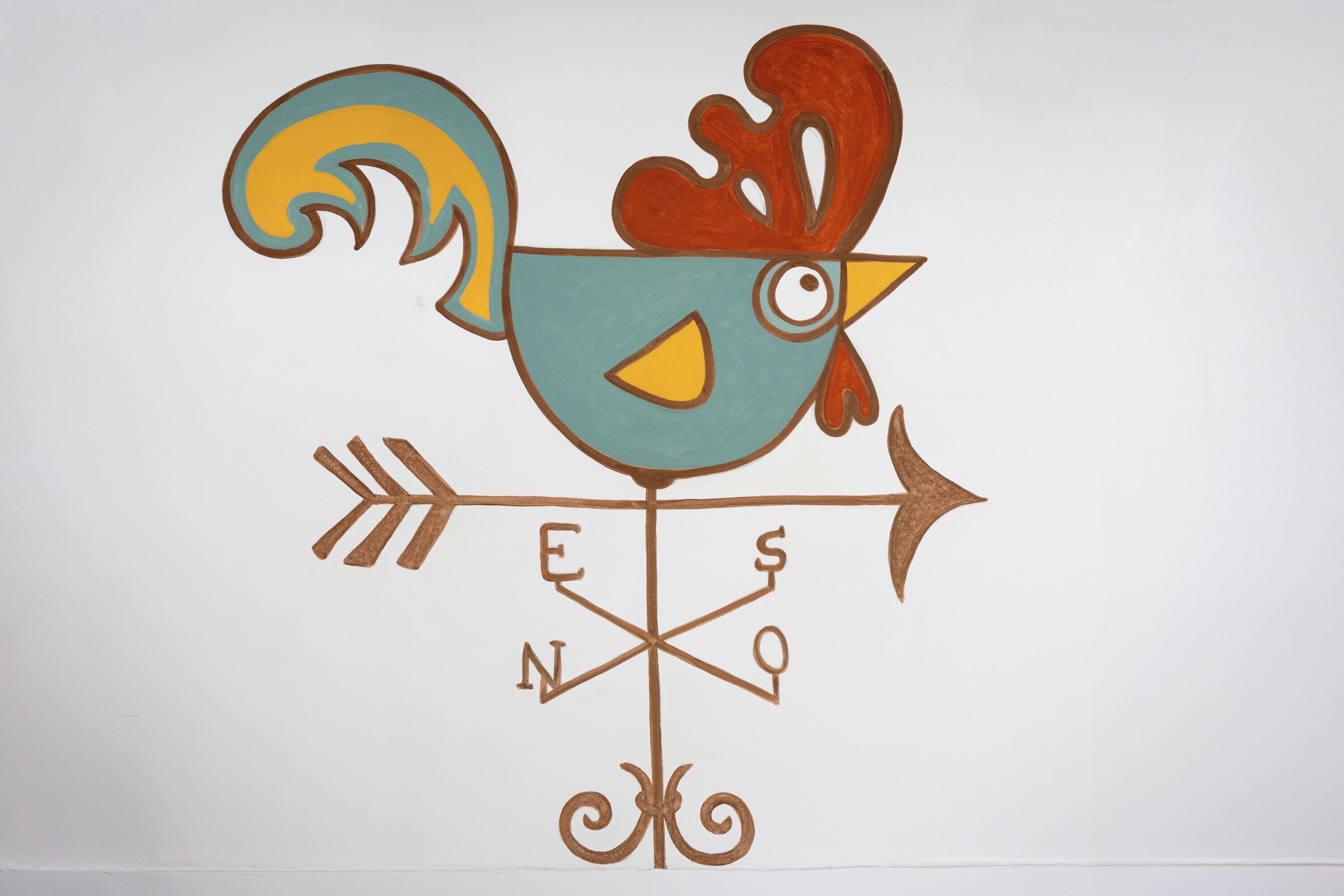 A stylized rooster with a compass design below it.