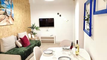 Apartment, 1 Bedroom | Living room | Flat-screen TV